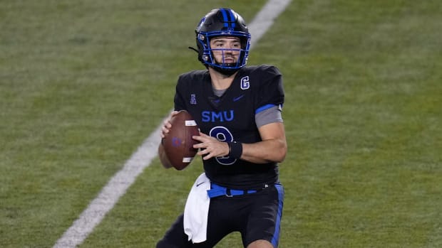 Nov 26, 2022; Dallas, Texas, USA; Southern Methodist Mustangs quarterback Tanner Mordecai (8) drops back to pass against the Memphis Tigers during the second half at Gerald J. Ford Stadium.